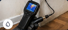 Thermal leak detection equipment near a wall