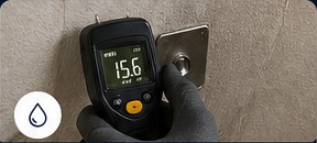 Moisture meter reading on a wall